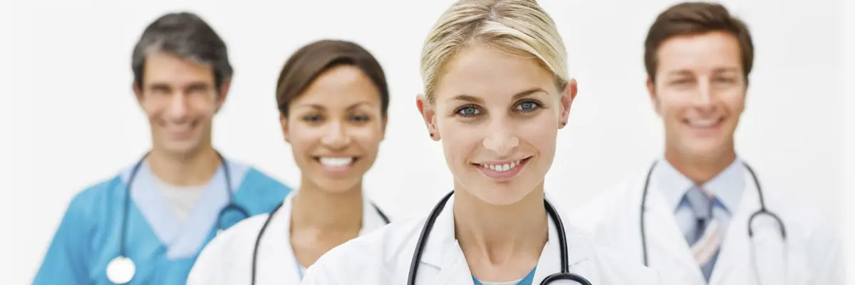 Two women doctors smiling for the camera.